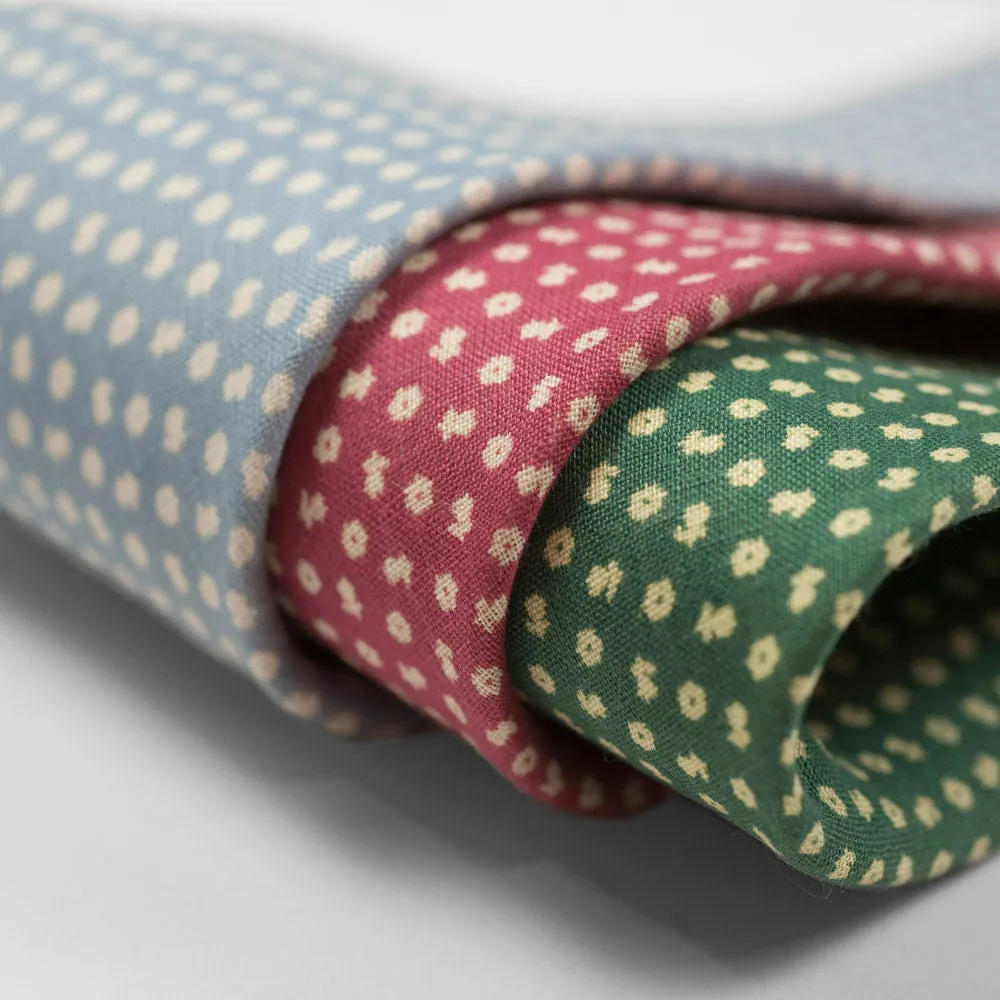 Rhubarb linen tie, white hand-printed flower motifs, self-tipped